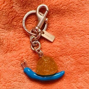Coach Snail Keychain in Blue and Gold